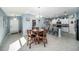 Open concept kitchen with white cabinets and island at 39822 Harmon Grove Ct, Zephyrhills, FL 33540