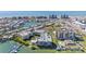 Aerial view of waterfront condo community with pool and boat docks at 399 150Th Ave # A203, Madeira Beach, FL 33708