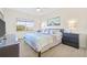 Well-lit bedroom featuring a ceiling fan, large window, and calming artwork at 399 150Th Ave # A203, Madeira Beach, FL 33708