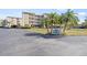 Three-story building with parking and landscaping at 399 150Th Ave # A203, Madeira Beach, FL 33708