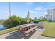 Outdoor picnic area with a grill, perfect for enjoying outdoor meals and gatherings at 399 150Th Ave # A203, Madeira Beach, FL 33708