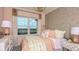 Charming bedroom with pink walls and a comfortable bed at 719 Sky Shade Dr, Apollo Beach, FL 33572