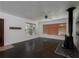 Living room featuring dark floors and a wood stove at 1009 19Th Sw St, Largo, FL 33770