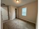 Well-lit bedroom with carpeted floor and double door closet at 12149 Creek Preserve Dr, Riverview, FL 33579