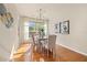 Dining room with hardwood floors, neutral walls, and large windows at 2215 Clarine N Way, Dunedin, FL 34698