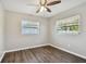 Spacious bedroom with wood-look flooring and ceiling fan at 2219 13Th Sw Ave, Largo, FL 33770