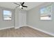 Bright bedroom with neutral walls and wood-look flooring at 243 45Th N St, St Petersburg, FL 33713