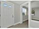 Bright entryway with white door and gray flooring at 243 45Th N St, St Petersburg, FL 33713