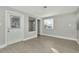 Living room with gray walls, vinyl flooring, and access to other rooms at 243 45Th N St, St Petersburg, FL 33713