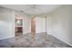 Bedroom with tile floors and access to the ensuite bathroom and walk-in closet at 29417 Caddyshack Ln, San Antonio, FL 33576