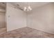 Simple dining area with tile floors and chandelier at 29417 Caddyshack Ln, San Antonio, FL 33576