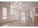 Spacious dining area with tile floors and a chandelier at 29417 Caddyshack Ln, San Antonio, FL 33576