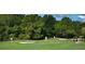 Golf course putting green with people playing at 29417 Caddyshack Ln, San Antonio, FL 33576