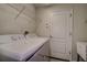 Laundry room with washer, dryer, and shelving at 29417 Caddyshack Ln, San Antonio, FL 33576