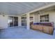 Relax on the covered patio featuring a private hot tub and direct access to the home through sliding glass doors at 29417 Caddyshack Ln, San Antonio, FL 33576