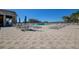 Community pool area with lounge chairs and tables at 29417 Caddyshack Ln, San Antonio, FL 33576