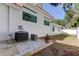 Side yard view of an AC unit and small plants at 310 Washington Ave, Oldsmar, FL 34677