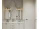 Elegant bathroom with double vanity, marble tile, and modern fixtures at 3819 71St N St, St Petersburg, FL 33709