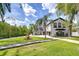 Charming home with manicured lawn, fountain, and a circular driveway at 4643 John Moore Rd, Brandon, FL 33511
