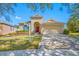 Nice curb appeal! This charming one-story home features a two-car garage and well-manicured lawn at 7343 Forest Mere Dr, Riverview, FL 33578