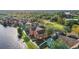 Aerial view of townhouses with lake access and walking paths at 9320 Lake Chase Island Way, Tampa, FL 33626