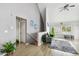 Living room with staircase, green couch, and gray walls at 9320 Lake Chase Island Way, Tampa, FL 33626