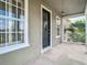 Covered balcony with access to the home's exterior at 10130 Balcony St, New Port Richey, FL 34655