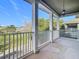 Covered balcony overlooking a lush green landscape at 10130 Balcony St, New Port Richey, FL 34655