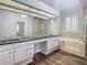 Elegant bathroom with double vanity, soaking tub, and shower at 10130 Balcony St, New Port Richey, FL 34655