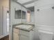Clean bathroom with granite countertop and white vanity at 10130 Balcony St, New Port Richey, FL 34655