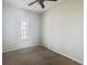Bright bedroom with carpet, ceiling fan and private balcony at 10130 Balcony St, New Port Richey, FL 34655