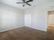 Spacious bedroom featuring carpet, double closet, and ceiling fan at 10130 Balcony St, New Port Richey, FL 34655