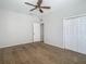 Spacious bedroom with ceiling fan and large closet at 10130 Balcony St, New Port Richey, FL 34655
