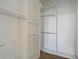 Large walk-in closet with double hanging rods and shelves at 10130 Balcony St, New Port Richey, FL 34655