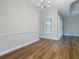 Spacious dining area with hardwood floors and window shutters at 10130 Balcony St, New Port Richey, FL 34655