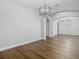 Dining room with hardwood floors and a modern light fixture at 10130 Balcony St, New Port Richey, FL 34655