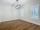 Bright dining room with hardwood floors and white walls at 10130 Balcony St, New Port Richey, FL 34655