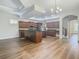 Open kitchen with island and dark wood cabinets at 10130 Balcony St, New Port Richey, FL 34655