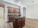 Kitchen features dark wood cabinets and granite countertops at 10130 Balcony St, New Port Richey, FL 34655