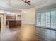 Open living space with hardwood floors and kitchen island at 10130 Balcony St, New Port Richey, FL 34655