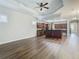 Open concept living area with hardwood floors and kitchen view at 10130 Balcony St, New Port Richey, FL 34655