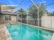 Refreshing screened pool with a spa at 10130 Balcony St, New Port Richey, FL 34655