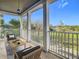 Relaxing covered porch with view of green space at 10130 Balcony St, New Port Richey, FL 34655