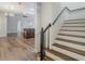 Modern staircase with dark wood accents and white risers at 10130 Balcony St, New Port Richey, FL 34655