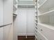 Spacious walk-in closet with ample shelving and hanging space at 10130 Balcony St, New Port Richey, FL 34655