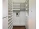 Large walk-in closet with built-in shelving and a safe at 10130 Balcony St, New Port Richey, FL 34655