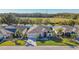 Community overview showcasing a row of houses with similar architecture at 10431 Machrihanish Cir, San Antonio, FL 33576