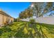 Spacious backyard with lush grass and a privacy fence at 10431 Machrihanish Cir, San Antonio, FL 33576