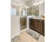 Well-appointed bathroom with spacious shower and dark wood cabinetry at 10431 Machrihanish Cir, San Antonio, FL 33576