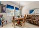 Bright dining area with round table and chairs at 10431 Machrihanish Cir, San Antonio, FL 33576